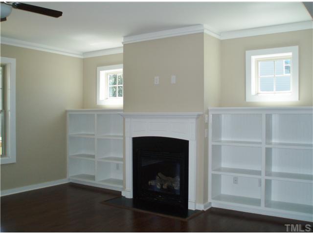 6100 Spring Branch Circle, Unit 42 Raleigh, NC 27603 - Photo 4 of 13 Family Room with gorgeous built-in's surrounding fireplace