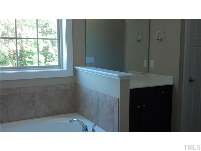 6100 Spring Branch Circle, Unit 42 Raleigh, NC 27603 - Photo 7 of 13 Master Bath Features Separate HIs/Hers vanities, garden tub and large walk-in shower.