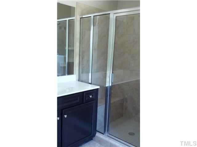 6100 Spring Branch Circle, Unit 42 Raleigh, NC 27603 - Photo 9 of 13 Master Shower with sitting bench.