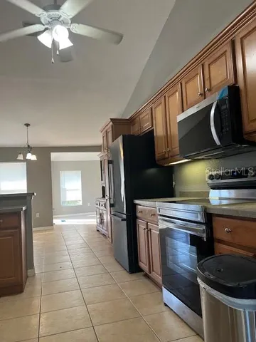 a kitchen with a stove and a microwave