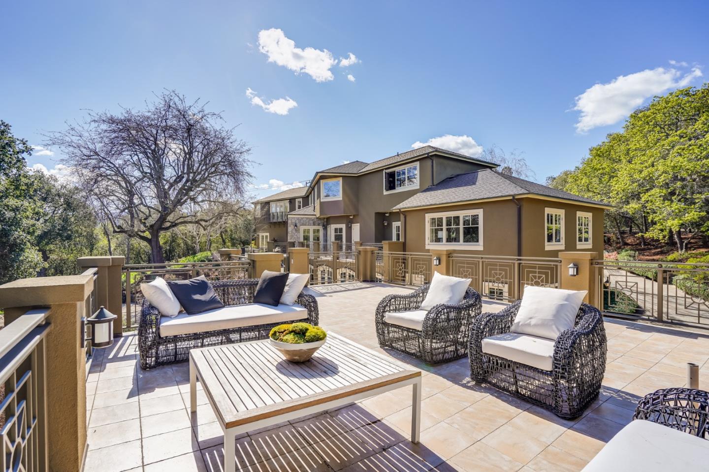 540 Moore Road Woodside, CA 94062 - Photo 12 of 85 a view of a patio with couches chairs and a dining table with garden view