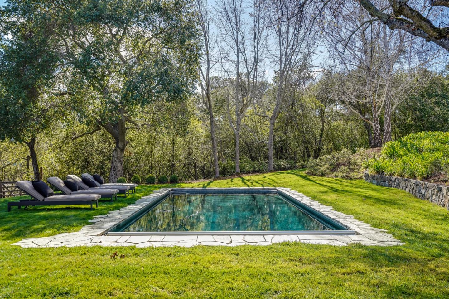 540 Moore Road Woodside, CA 94062 - Photo 21 of 85 a view of a swimming pool with a yard