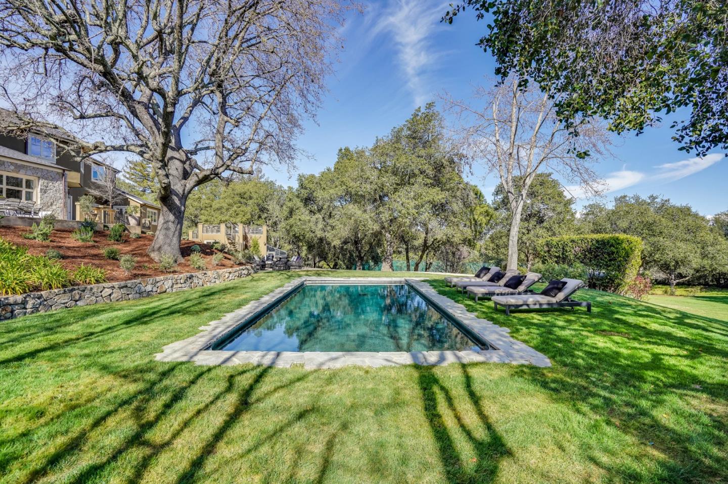540 Moore Road Woodside, CA 94062 - Photo 23 of 85 a view of yard with swimming pool and outdoor seating