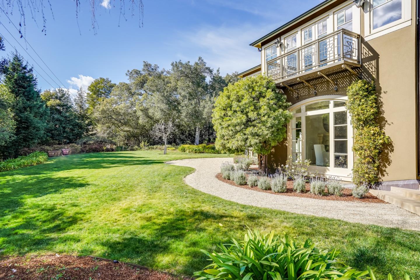 540 Moore Road Woodside, CA 94062 - Photo 25 of 85 a front view of a house with a yard