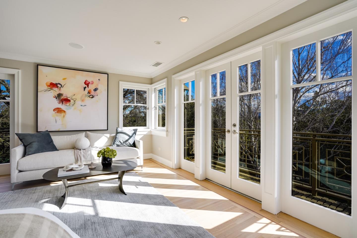 540 Moore Road Woodside, CA 94062 - Photo 49 of 85 a living room with furniture a floor to ceiling window and a flat screen tv