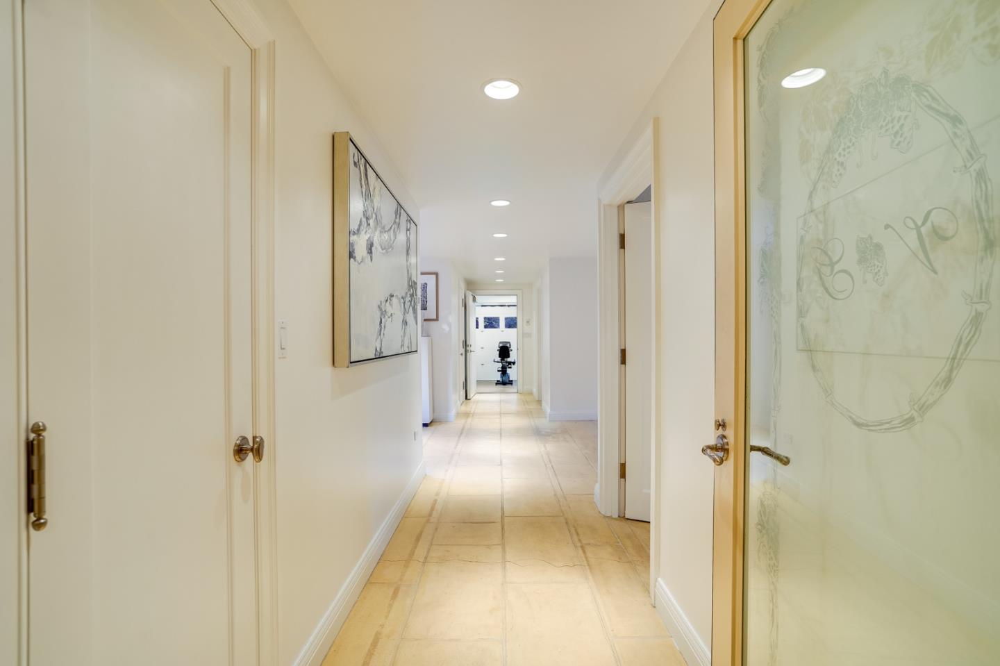 540 Moore Road Woodside, CA 94062 - Photo 78 of 85 a view of a hallway with wooden floor and a bathroom