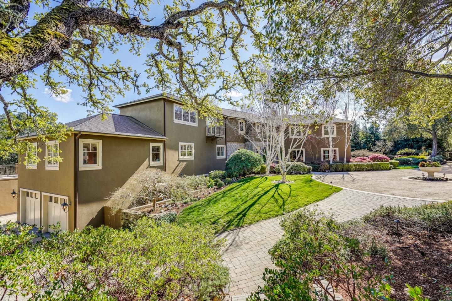540 Moore Road Woodside, CA 94062 - Photo 10 of 85 a front view of a house with a yard and pathway