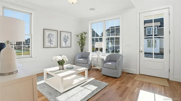 a living room with furniture and windows