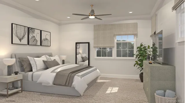 a spacious bedroom with a large bed and a potted plant