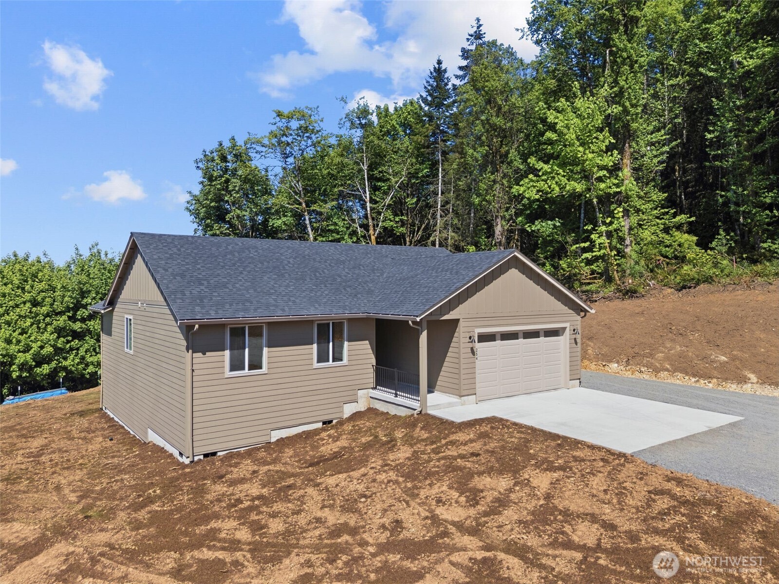 254 Windy Ridge Drive Longview, WA 98632 - Photo 1 of 27 a house with trees in the background