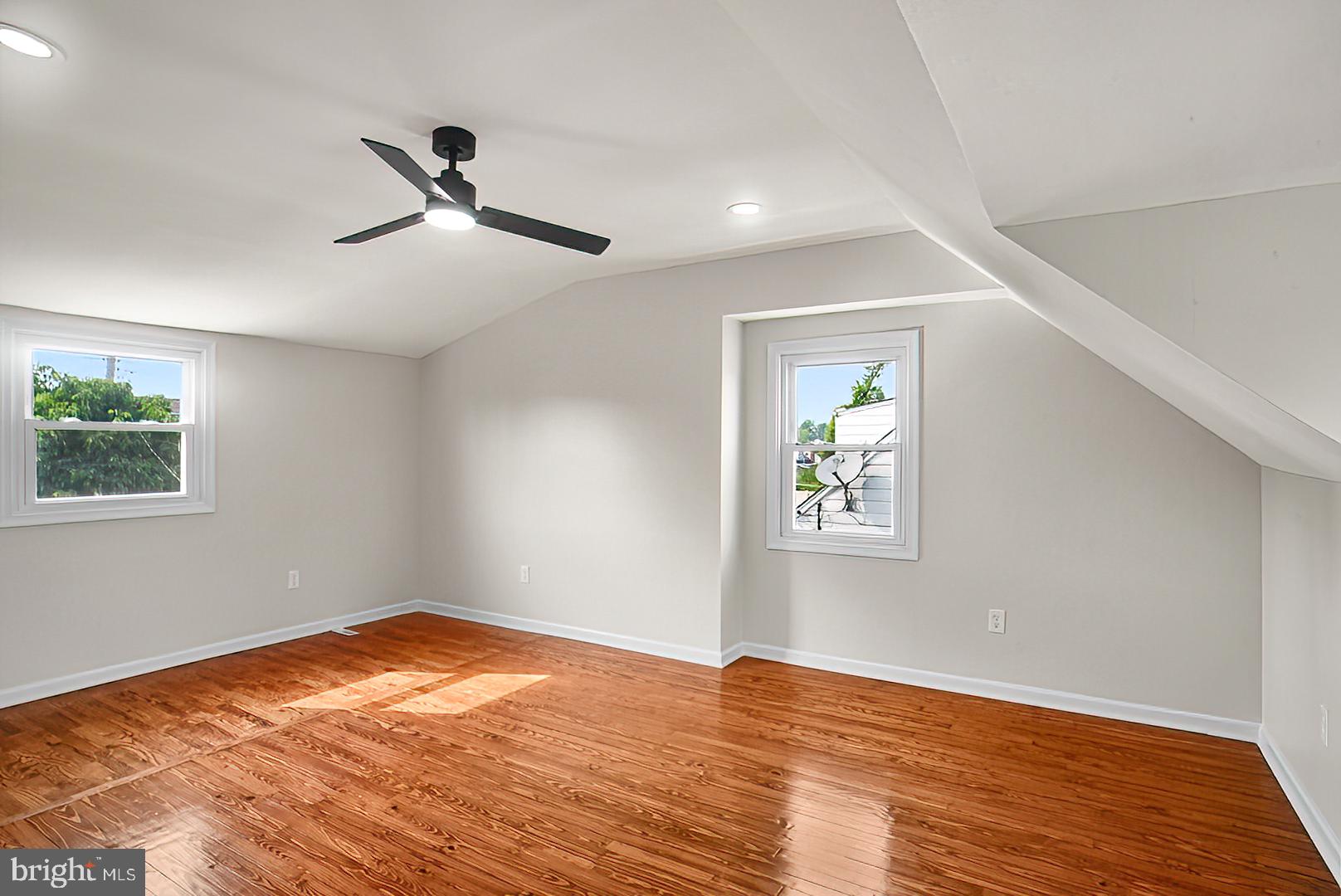 3316 Fairview Road Baltimore, MD 21207 - Photo 20 of 41 a view of empty room with wooden floor and fan