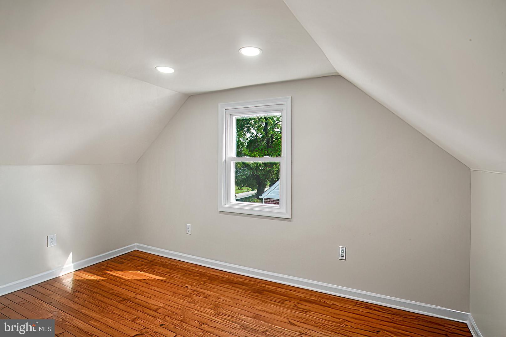 3316 Fairview Road Baltimore, MD 21207 - Photo 24 of 41 wooden floor in an empty room with a window