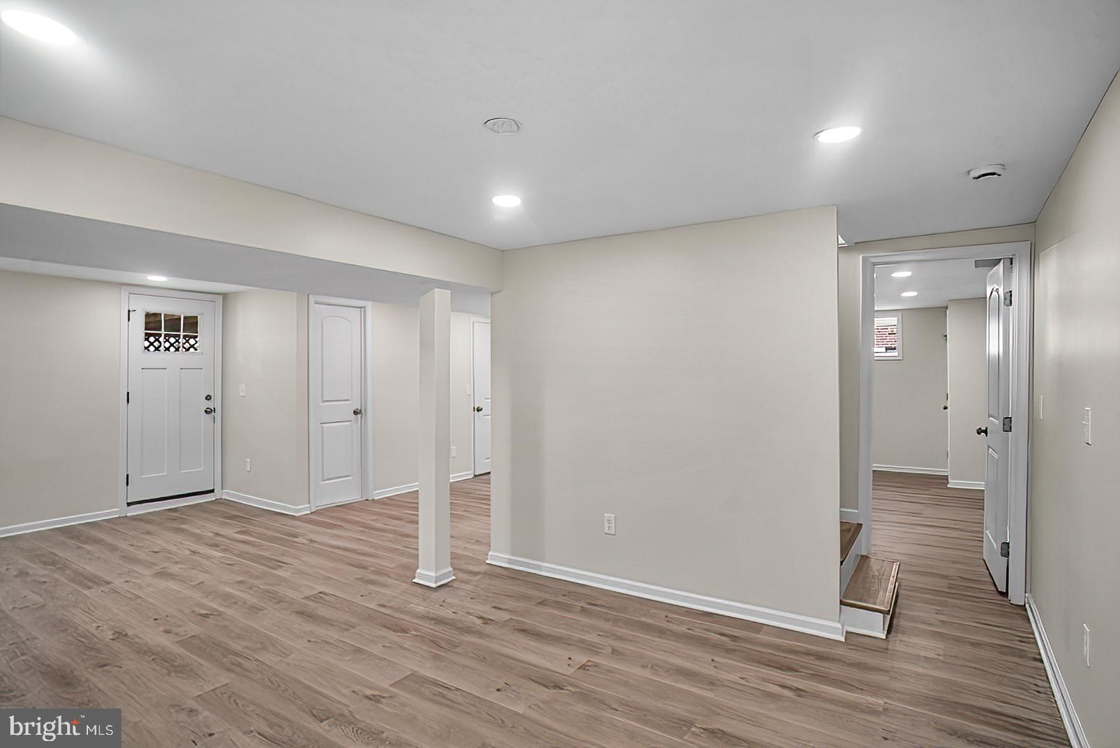 3316 Fairview Road Baltimore, MD 21207 - Photo 26 of 41 a view of an empty room with wooden floor