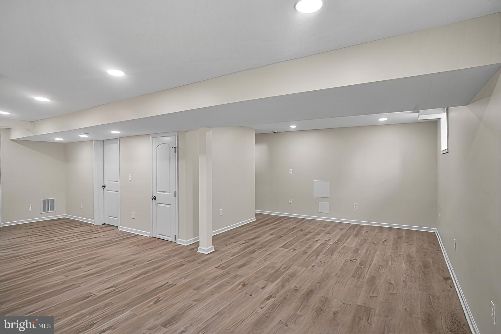 3316 Fairview Road Baltimore, MD 21207 - Photo 27 of 41 a view of an empty room with wooden floor