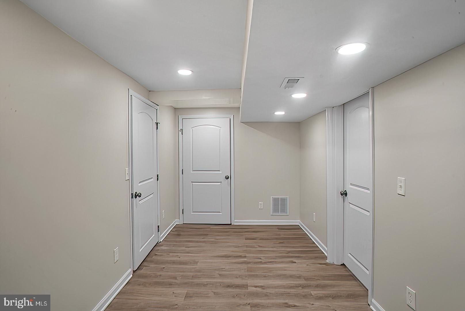 3316 Fairview Road Baltimore, MD 21207 - Photo 28 of 41 a view of a hallway with wooden floor