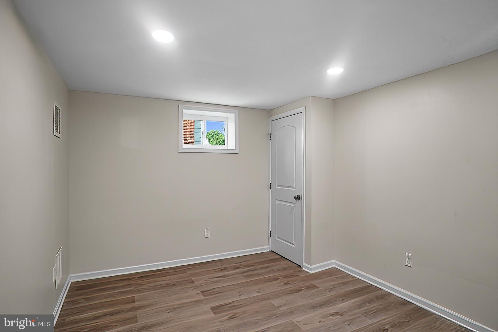 3316 Fairview Road Baltimore, MD 21207 - Photo 29 of 41 a view of an empty room with wooden floor
