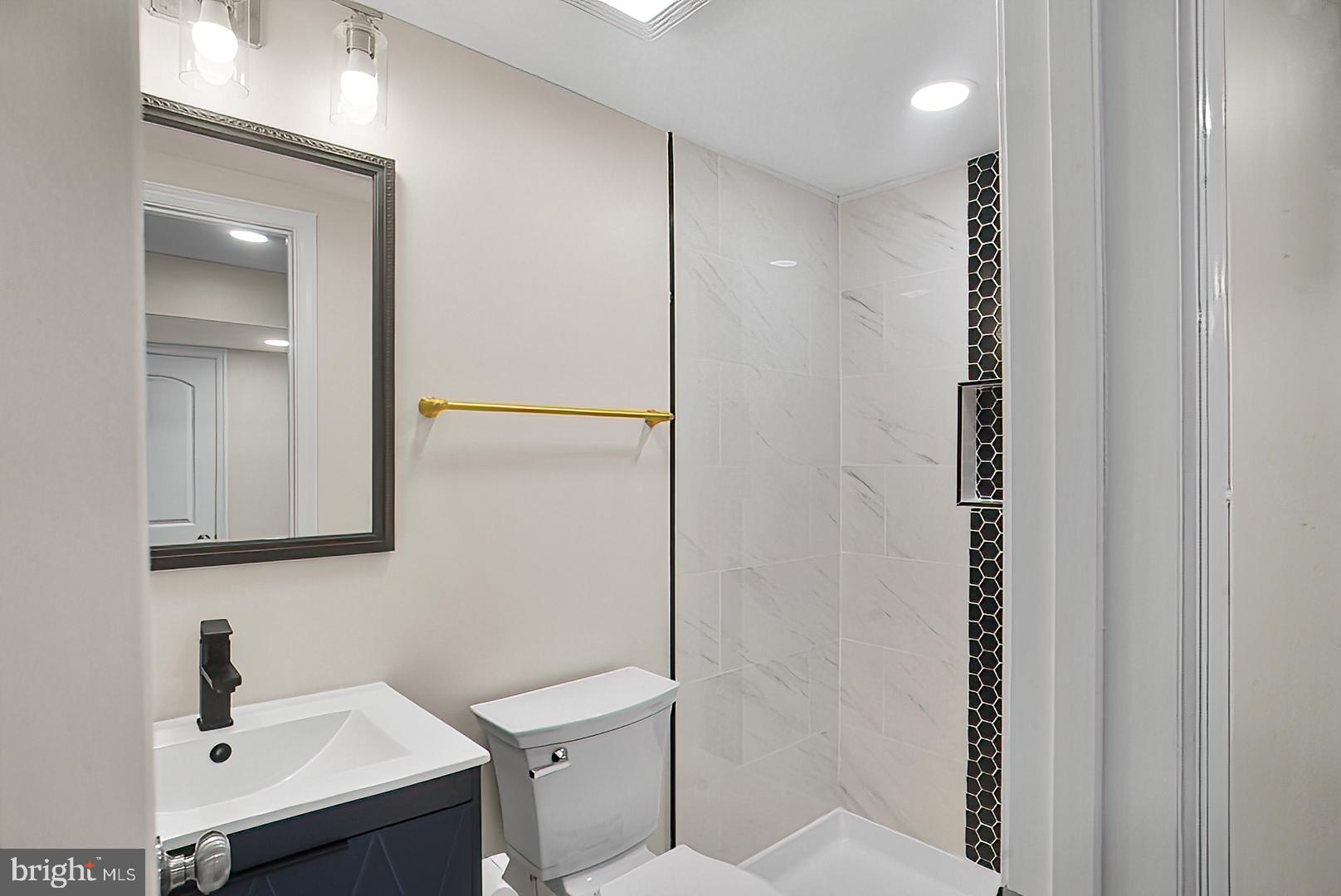 3316 Fairview Road Baltimore, MD 21207 - Photo 9 of 41 a bathroom with a sink and mirror