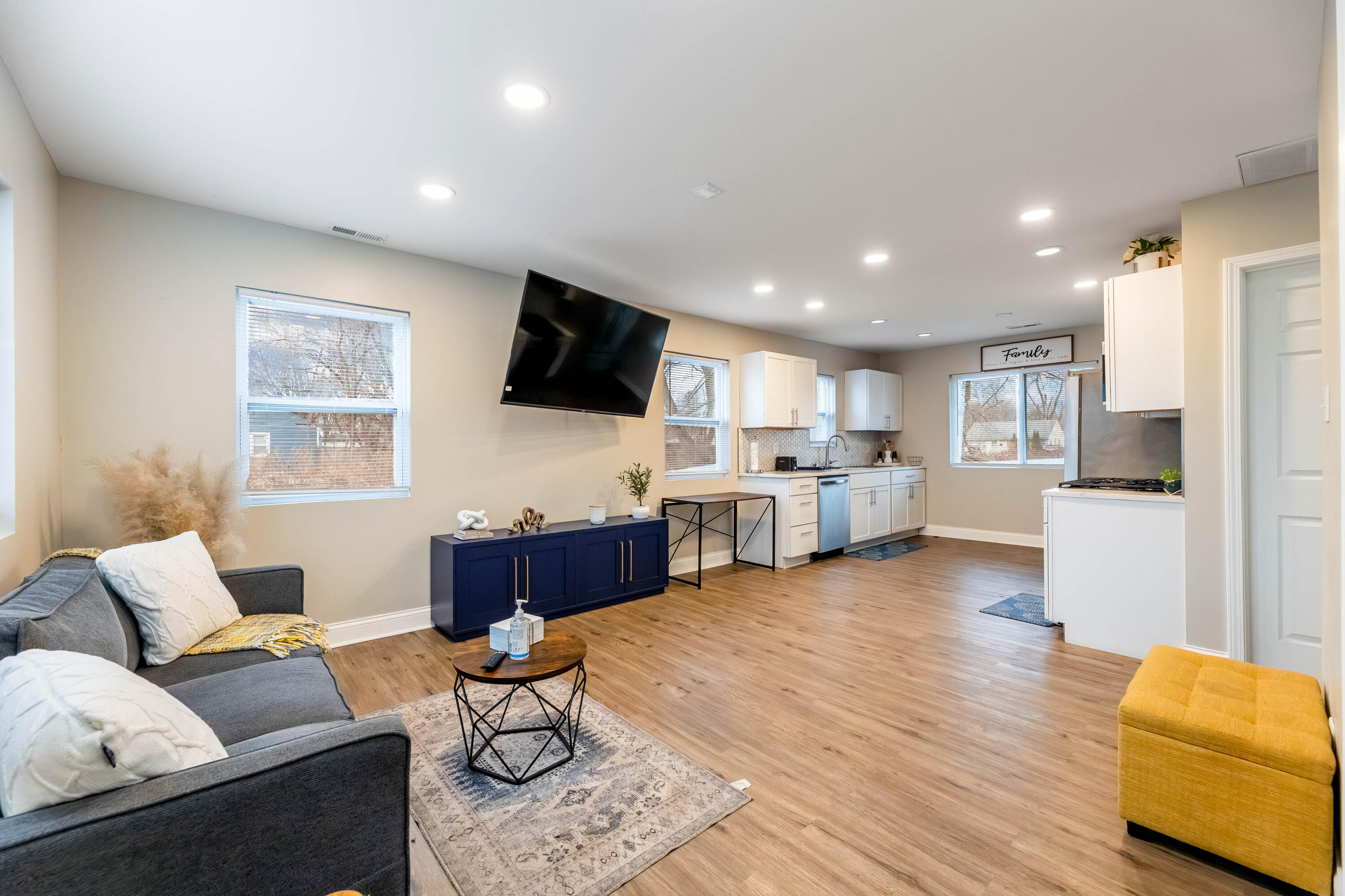 1151 Benton Street Gary, IN 46403 - Photo 4 of 23 a living room with furniture flat screen tv and kitchen view