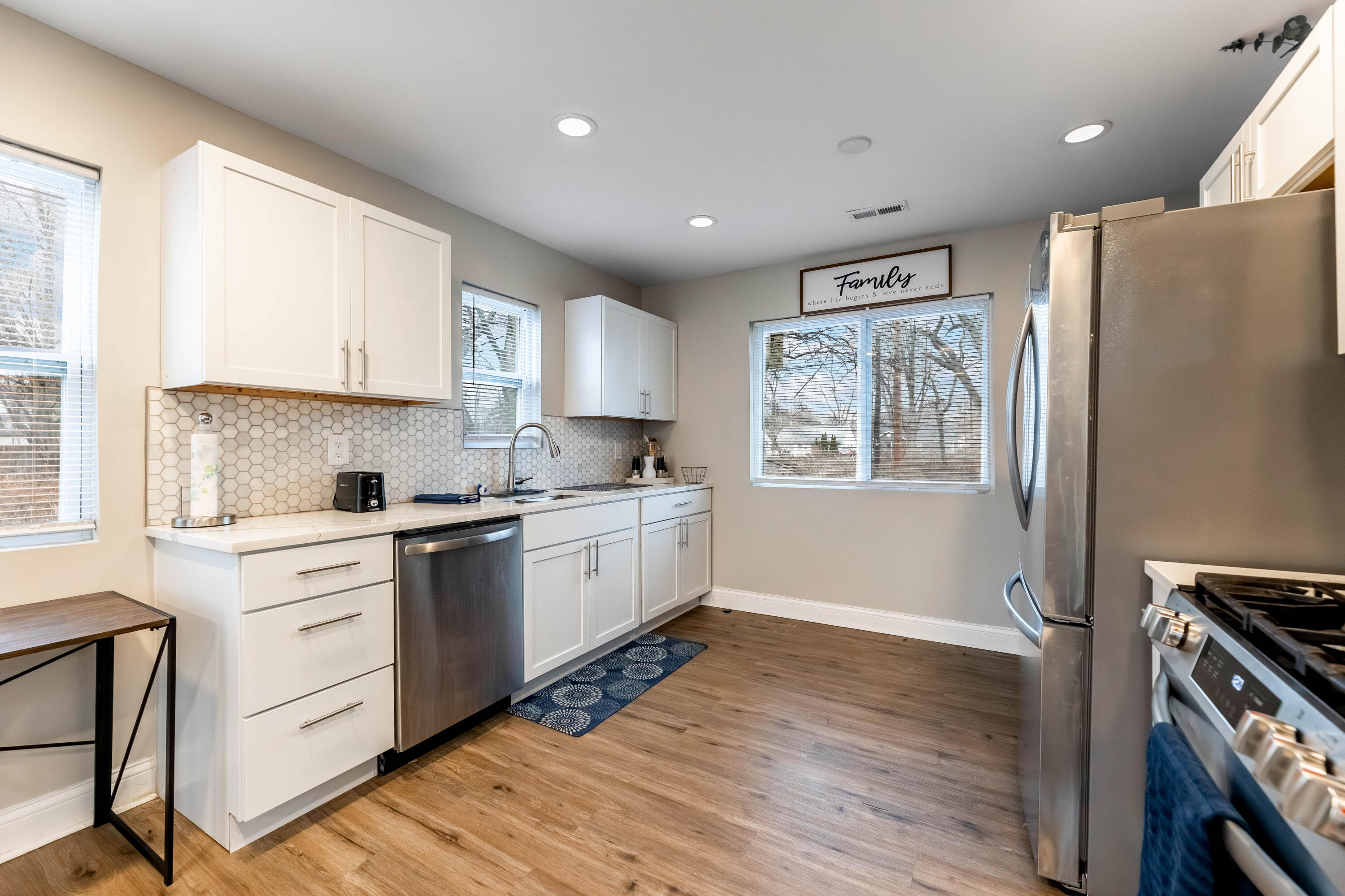 1151 Benton Street Gary, IN 46403 - Photo 7 of 23 a kitchen with a refrigerator stove and sink