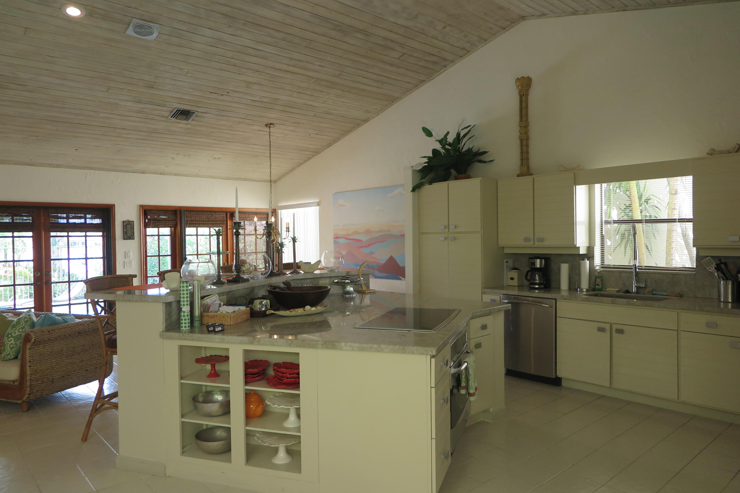 22519 Esplanada Circle Boca Raton, FL 33433 - Photo 5 of 15 a kitchen with stainless steel appliances kitchen island granite countertop a sink and cabinets