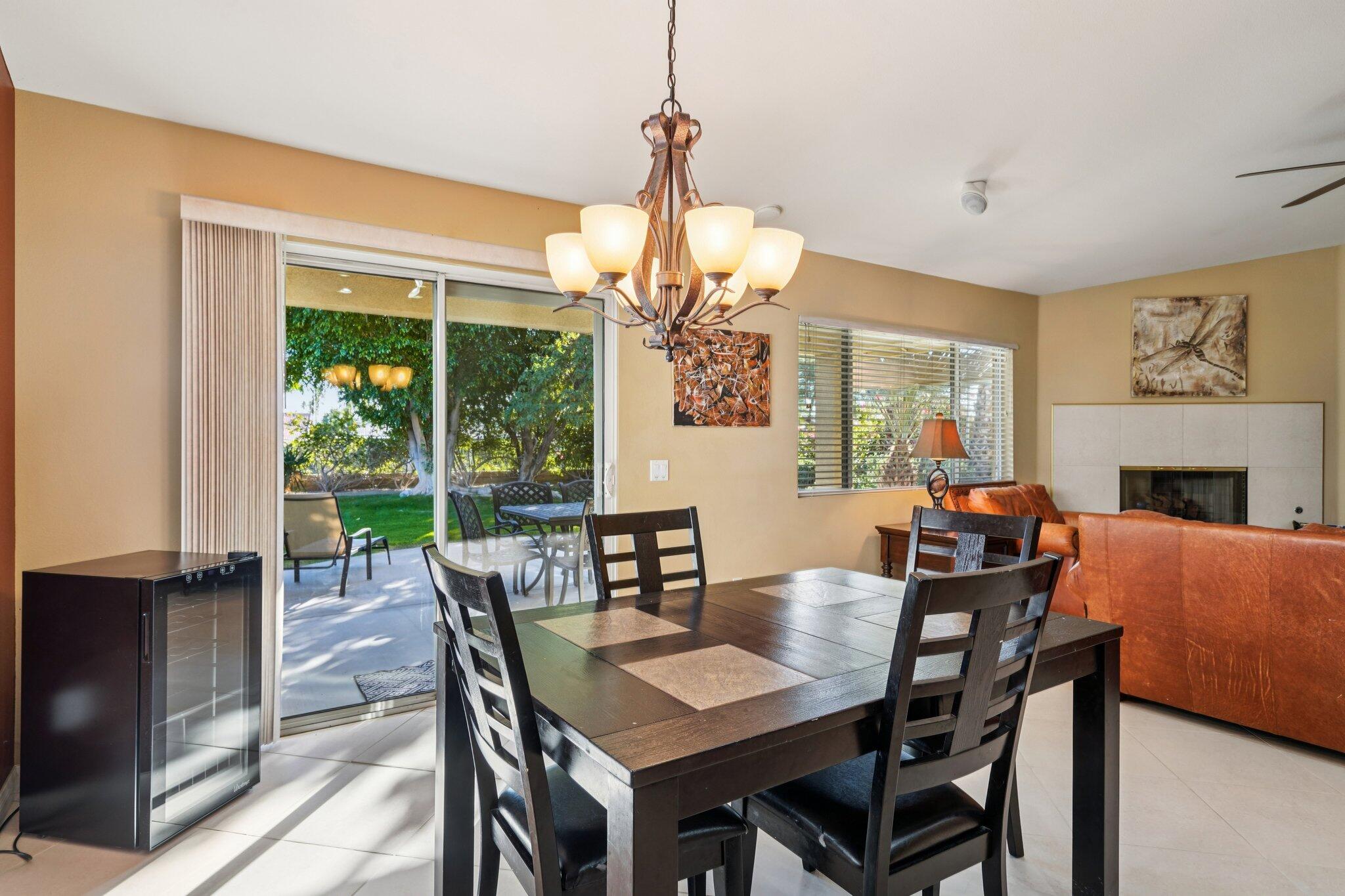 49382 Wayne Street Indio, CA 92201 - Photo 11 of 69 a view of a dining room with furniture window and outside view
