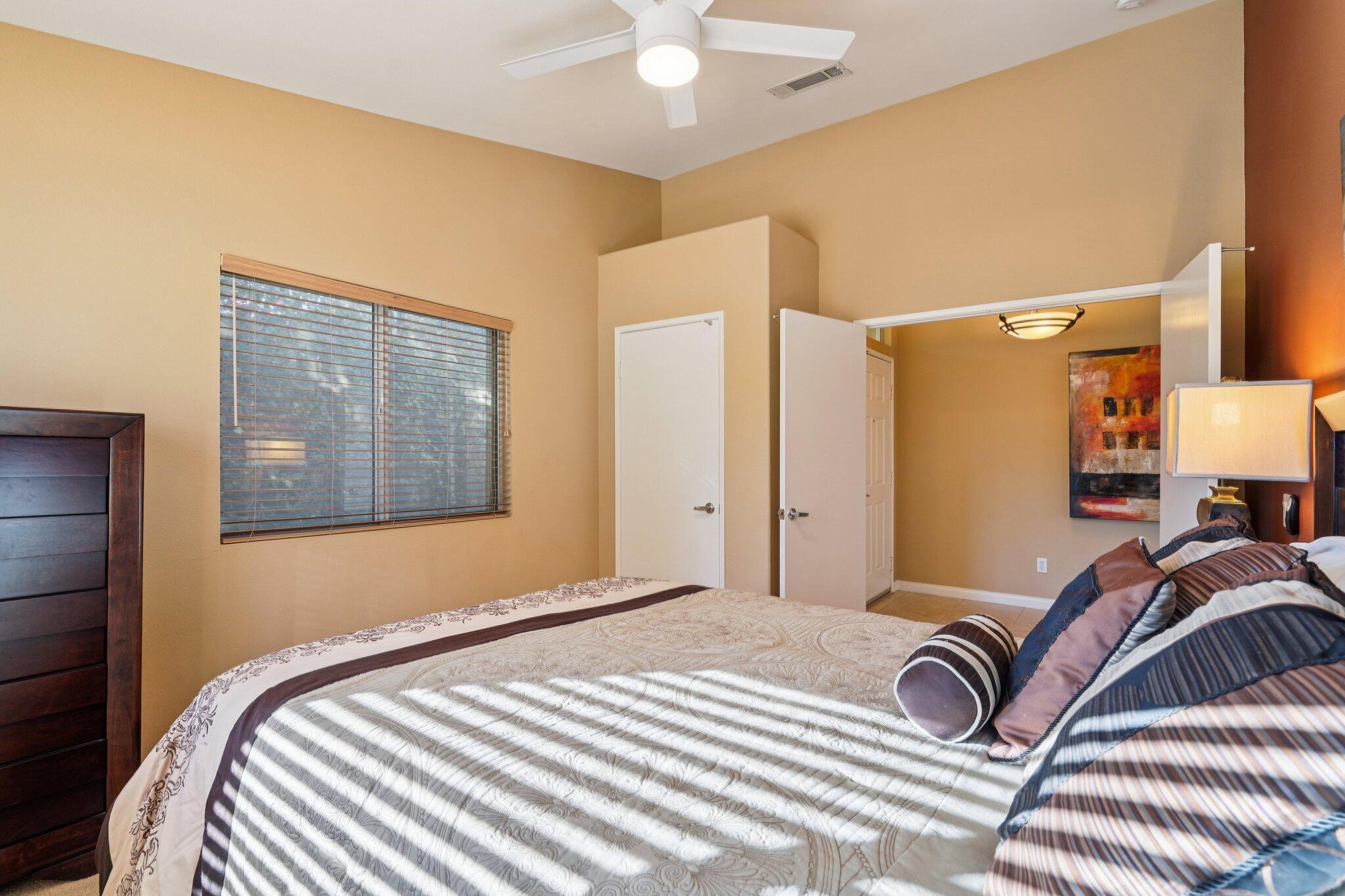 49382 Wayne Street Indio, CA 92201 - Photo 19 of 69 a bedroom with a bed and a painting on the wall