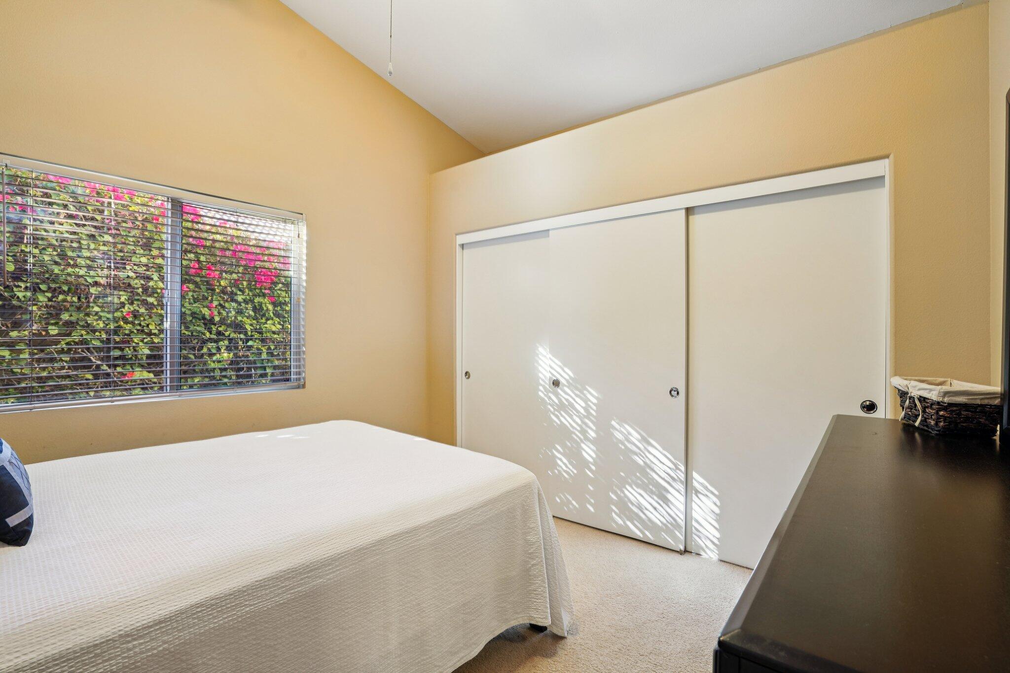 49382 Wayne Street Indio, CA 92201 - Photo 21 of 69 a bedroom with a bed and a large window