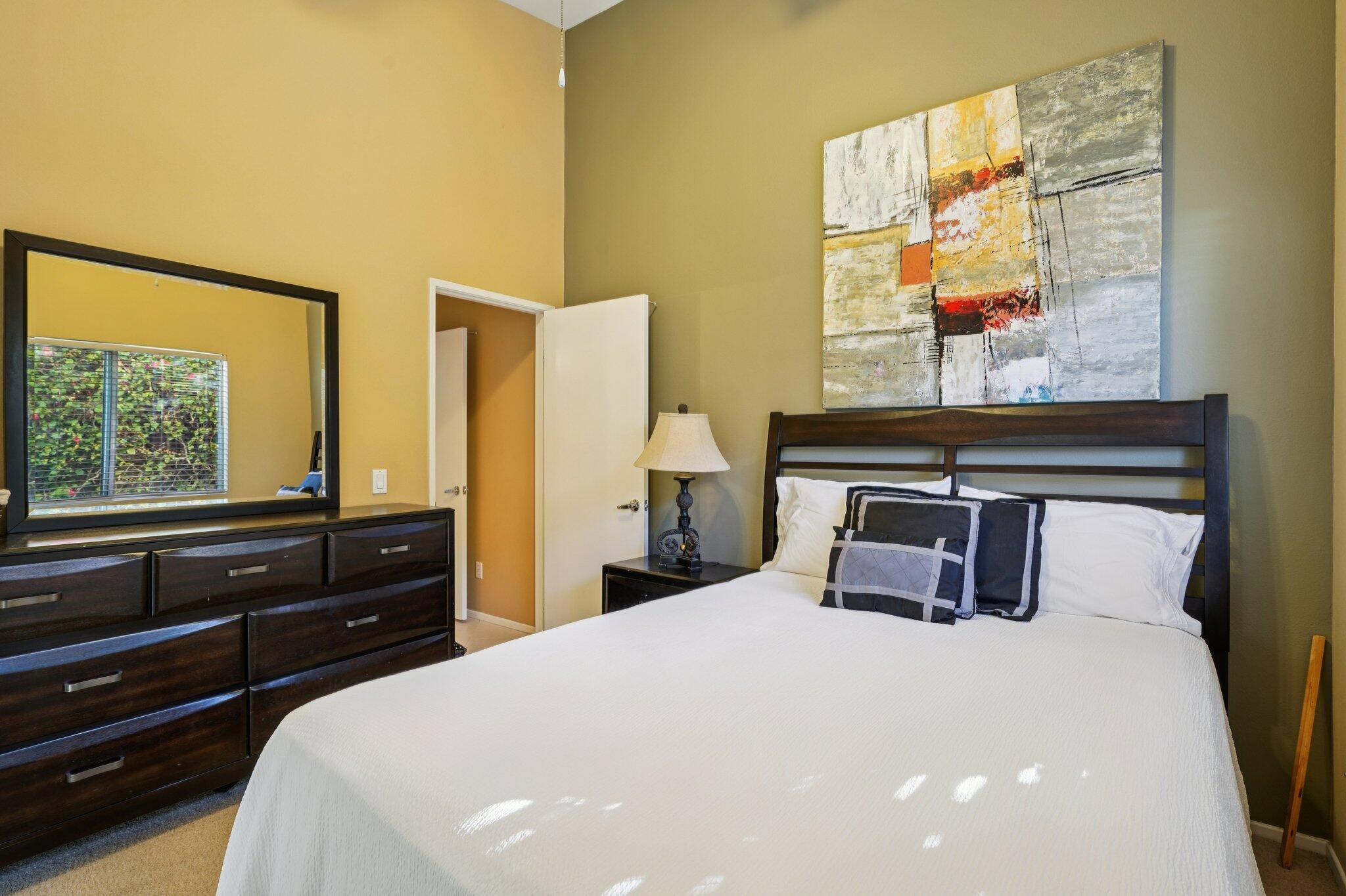 49382 Wayne Street Indio, CA 92201 - Photo 22 of 69 a bedroom with a bed and a large window