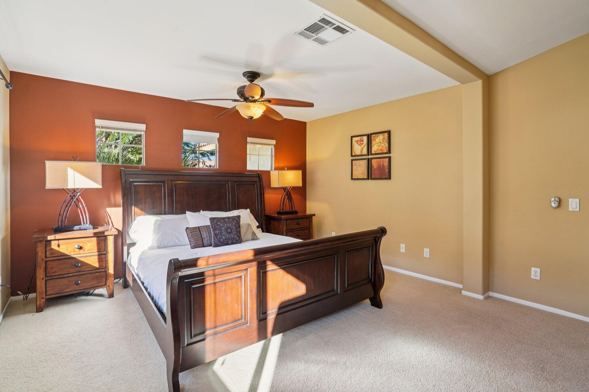 49382 Wayne Street Indio, CA 92201 - Photo 24 of 69 a bed room with a bed and a chandelier