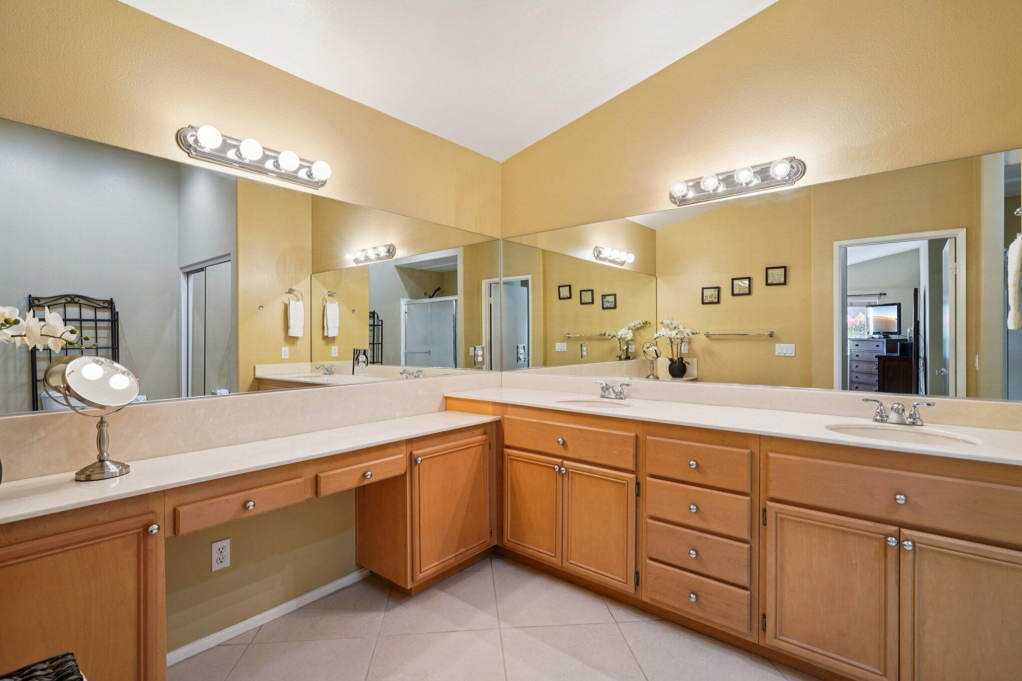 49382 Wayne Street Indio, CA 92201 - Photo 27 of 69 a spacious bathroom with a double vanity sink and a mirror