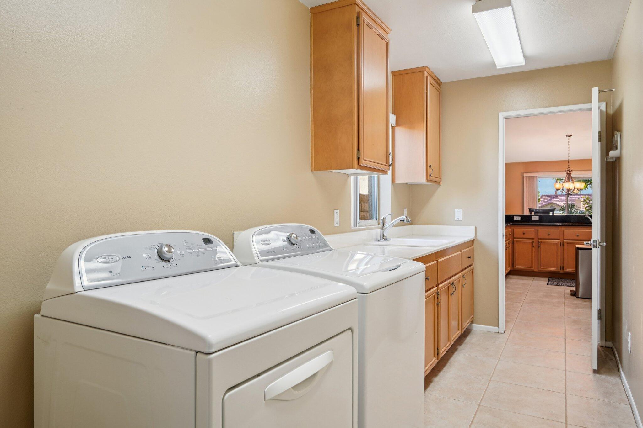 49382 Wayne Street Indio, CA 92201 - Photo 30 of 69 a utility room with dryer and washer