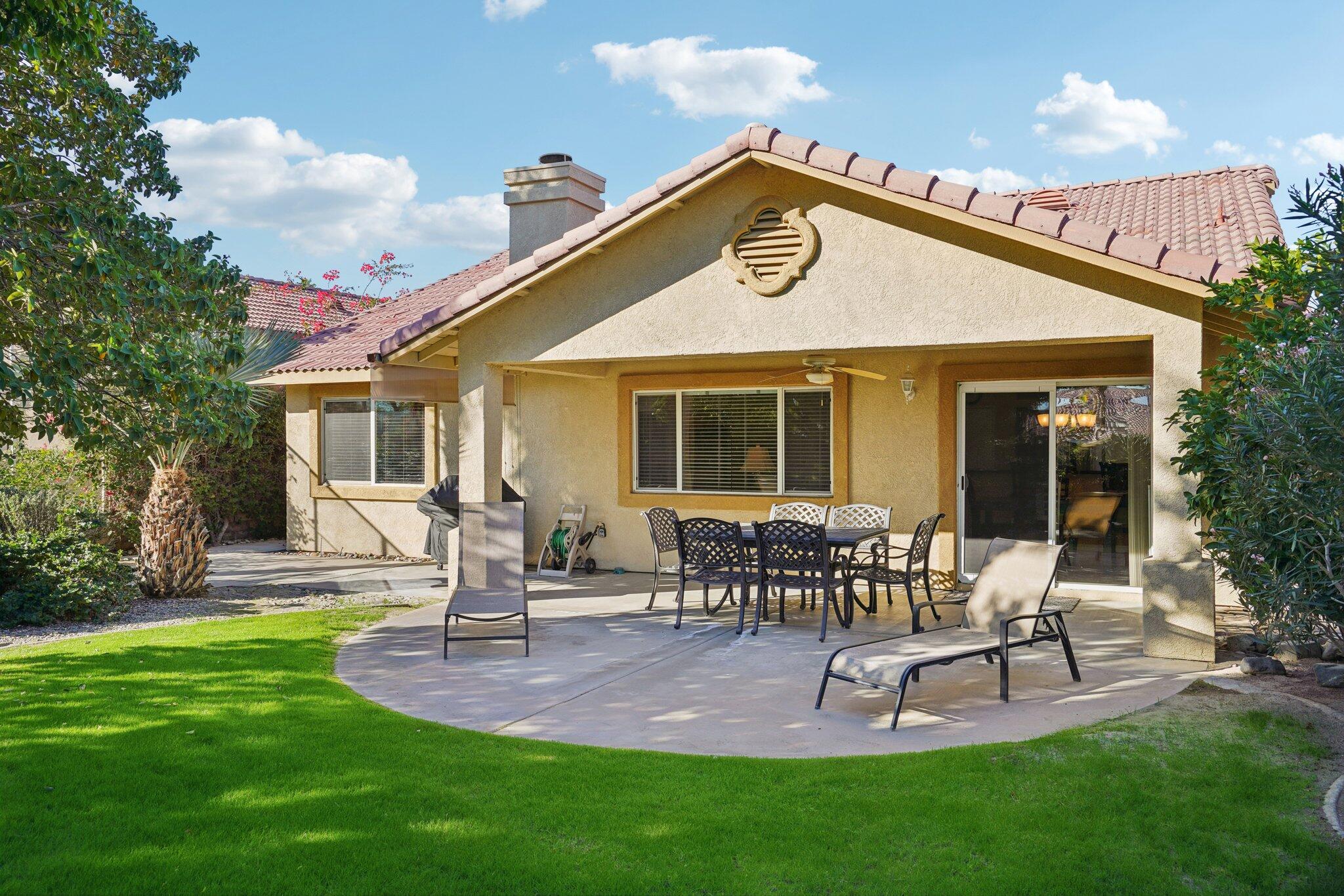 49382 Wayne Street Indio, CA 92201 - Photo 32 of 69 a view of a house with a yard patio and fire pit