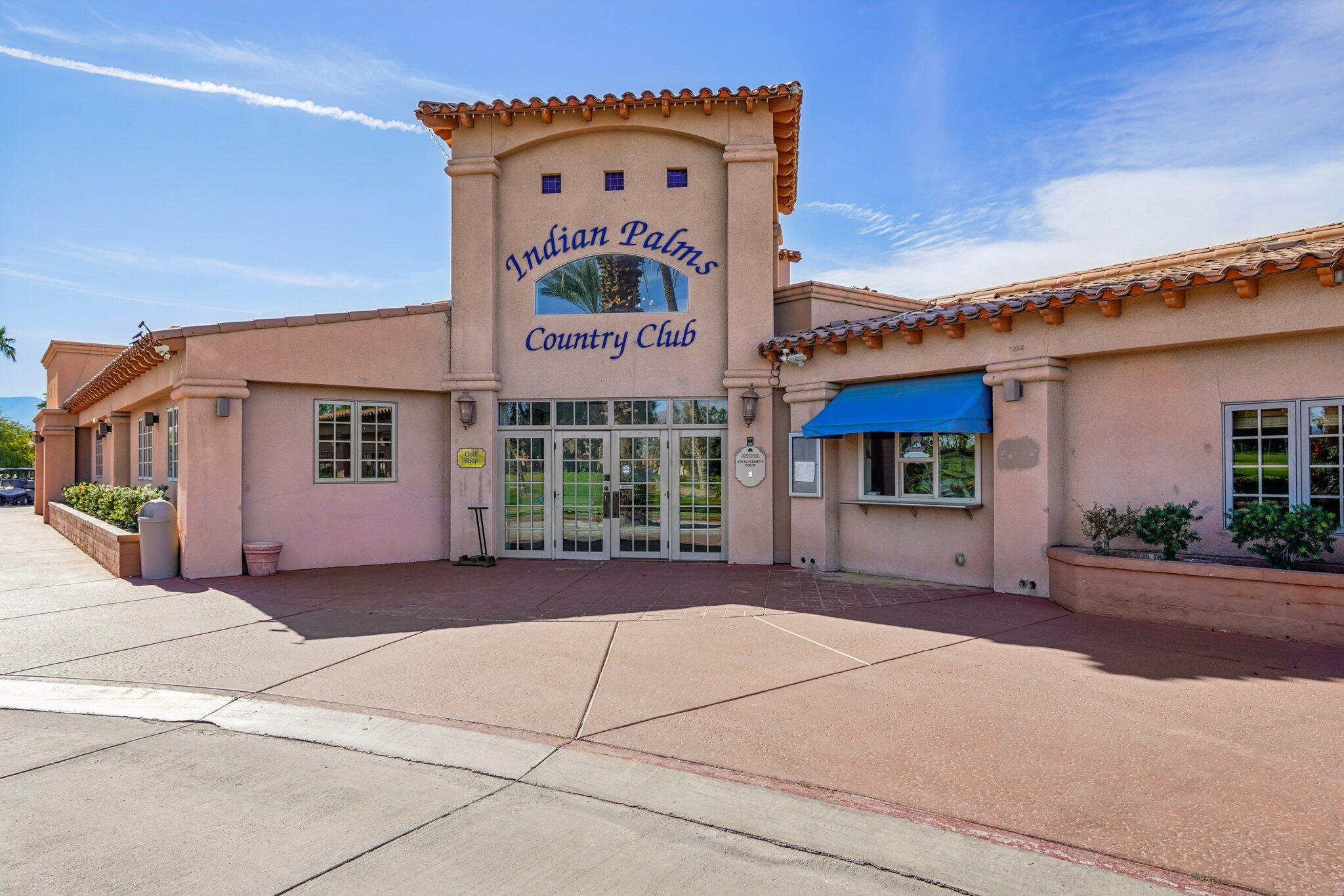 49382 Wayne Street Indio, CA 92201 - Photo 47 of 69 a front view of a building with a yard and garage
