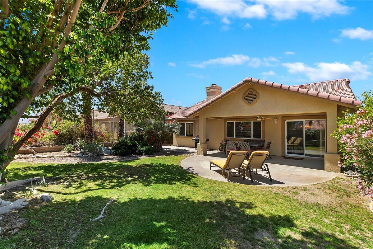 49382 Wayne Street Indio, CA 92201 - Photo 61 of 69 a front view of a house with a yard table and chairs