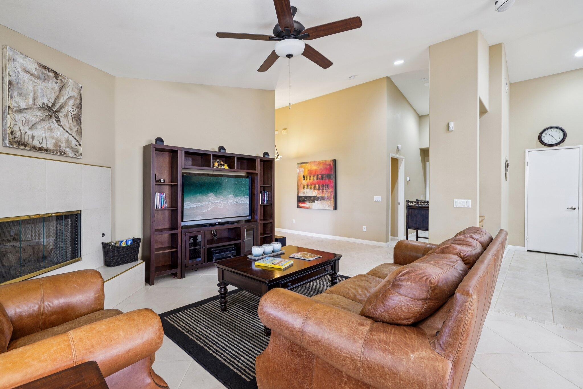 49382 Wayne Street Indio, CA 92201 - Photo 7 of 69 a living room with furniture a fireplace and a flat screen tv