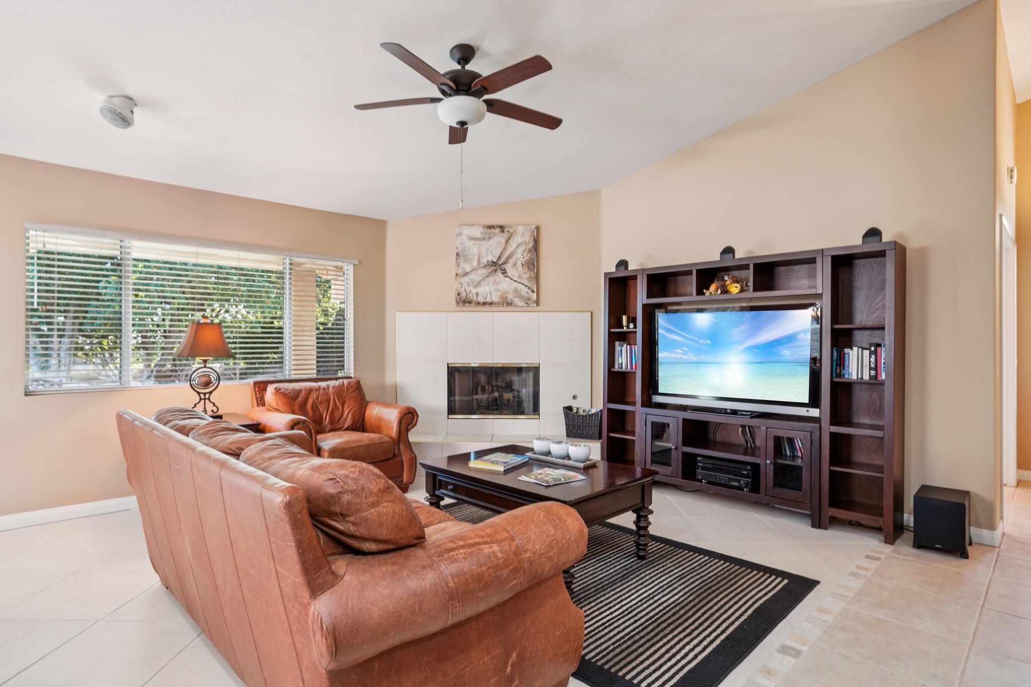 49382 Wayne Street Indio, CA 92201 - Photo 8 of 69 a living room with furniture and a flat screen tv