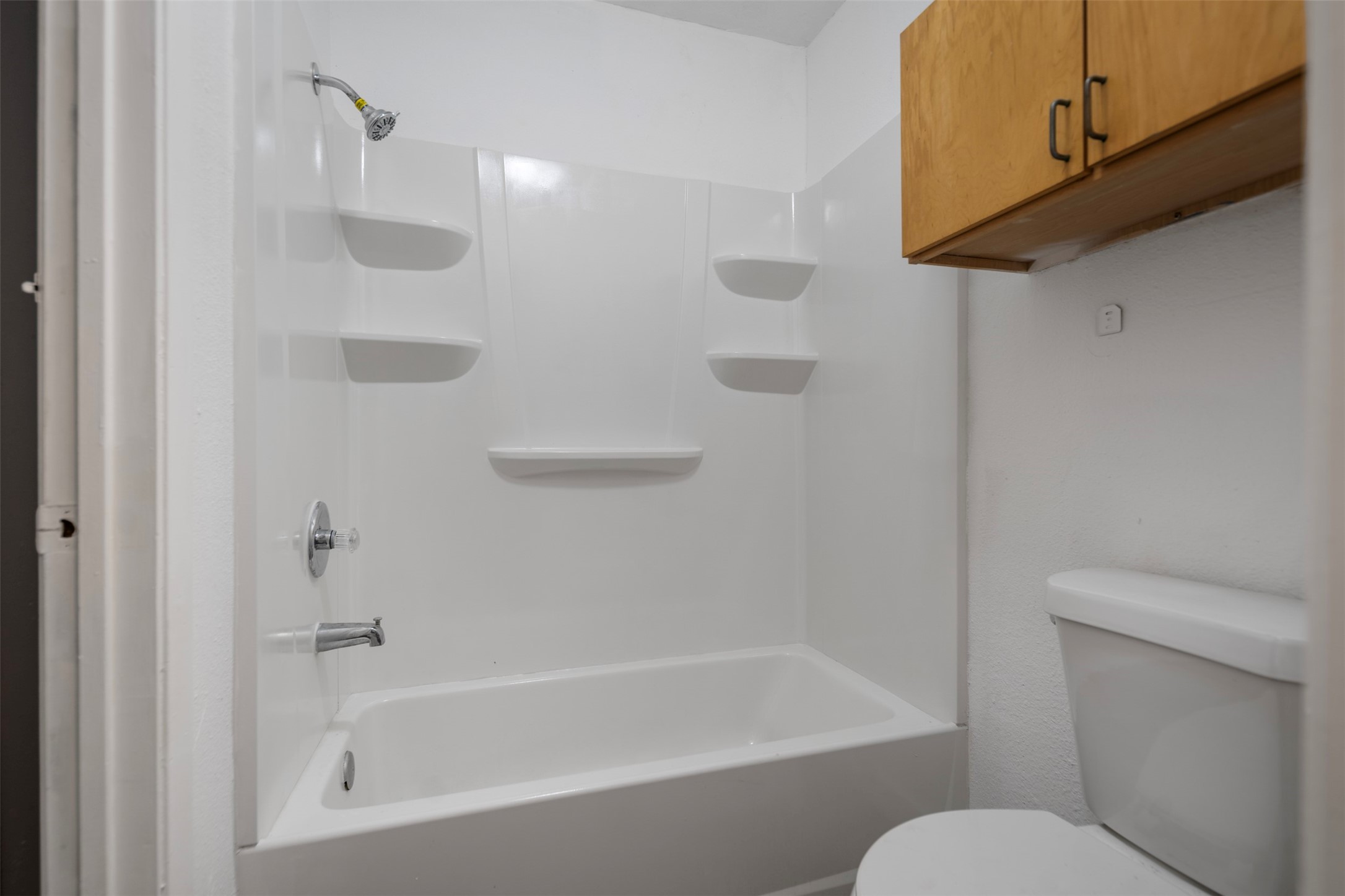 1204 Crescent Boulevard Cleveland, TX 77327 - Photo 15 of 24 a bathroom with a toilet and a bathtub
