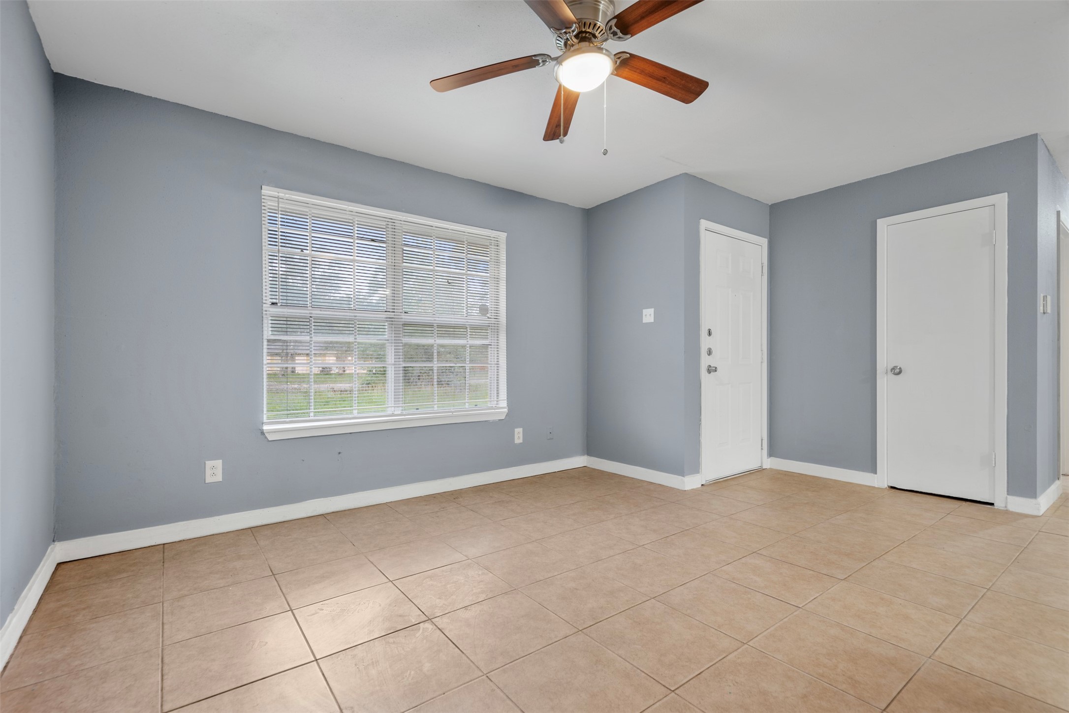 1204 Crescent Boulevard Cleveland, TX 77327 - Photo 18 of 24 a view of an empty room with a window