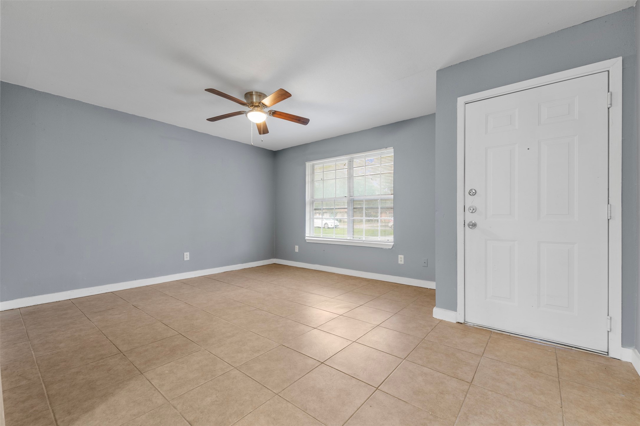1204 Crescent Boulevard Cleveland, TX 77327 - Photo 19 of 24 a view of an empty room with a window