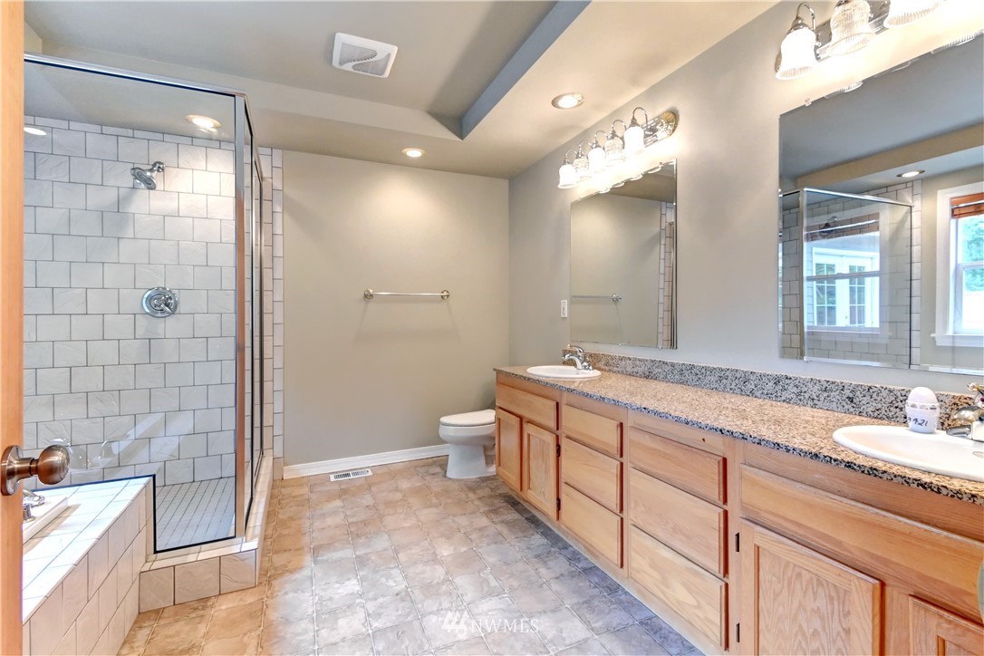 425 South Cabot Road Everett, WA 98203 - Photo 13 of 24 a spacious bathroom with a double vanity sink mirror and shower