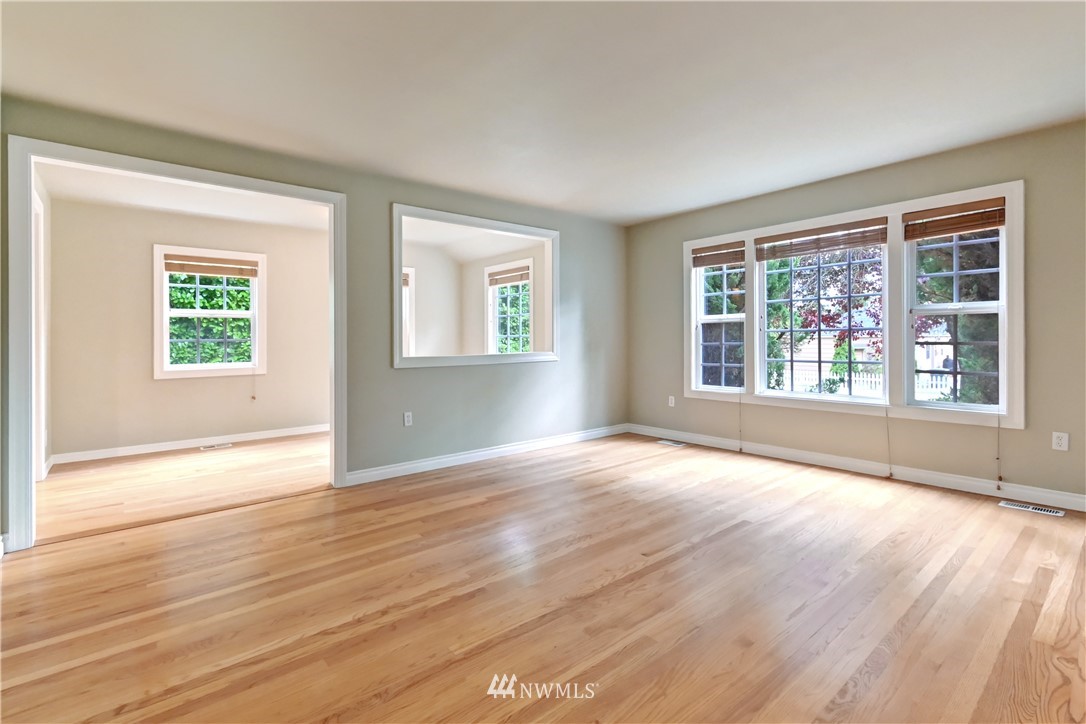 425 South Cabot Road Everett, WA 98203 - Photo 5 of 24 a view of an empty room with wooden floor and a window
