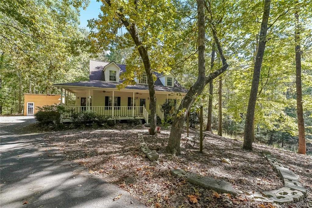 6554 Fox Run Winston, GA 30187 - Photo 1 of 40 a view of a house with a yard