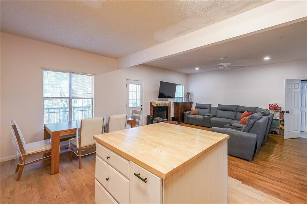 6554 Fox Run Winston, GA 30187 - Photo 11 of 40 a living room with furniture a fireplace and a flat screen tv