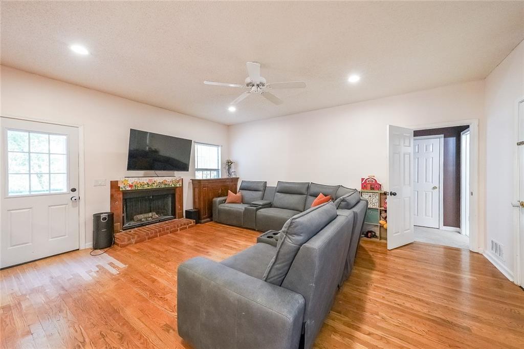 6554 Fox Run Winston, GA 30187 - Photo 12 of 40 a living room with furniture and a flat screen tv
