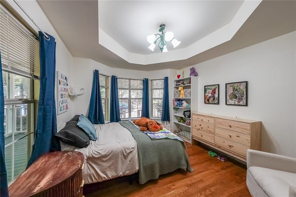 6554 Fox Run Winston, GA 30187 - Photo 18 of 40 a bedroom with a bed and wooden floor