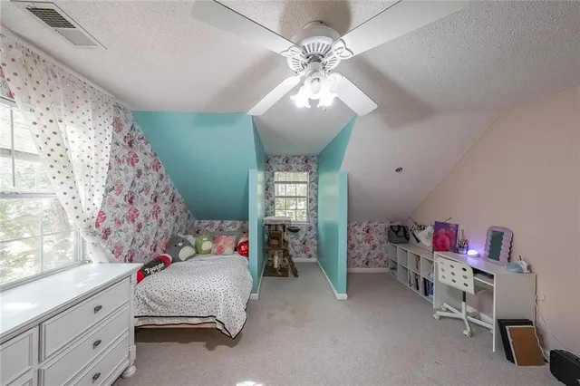 a bedroom with furniture and a chandelier