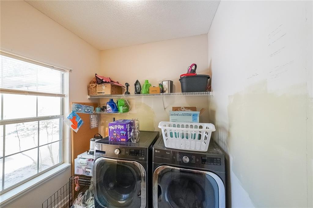 6554 Fox Run Winston, GA 30187 - Photo 26 of 40 a utility room with dryer washer and a window