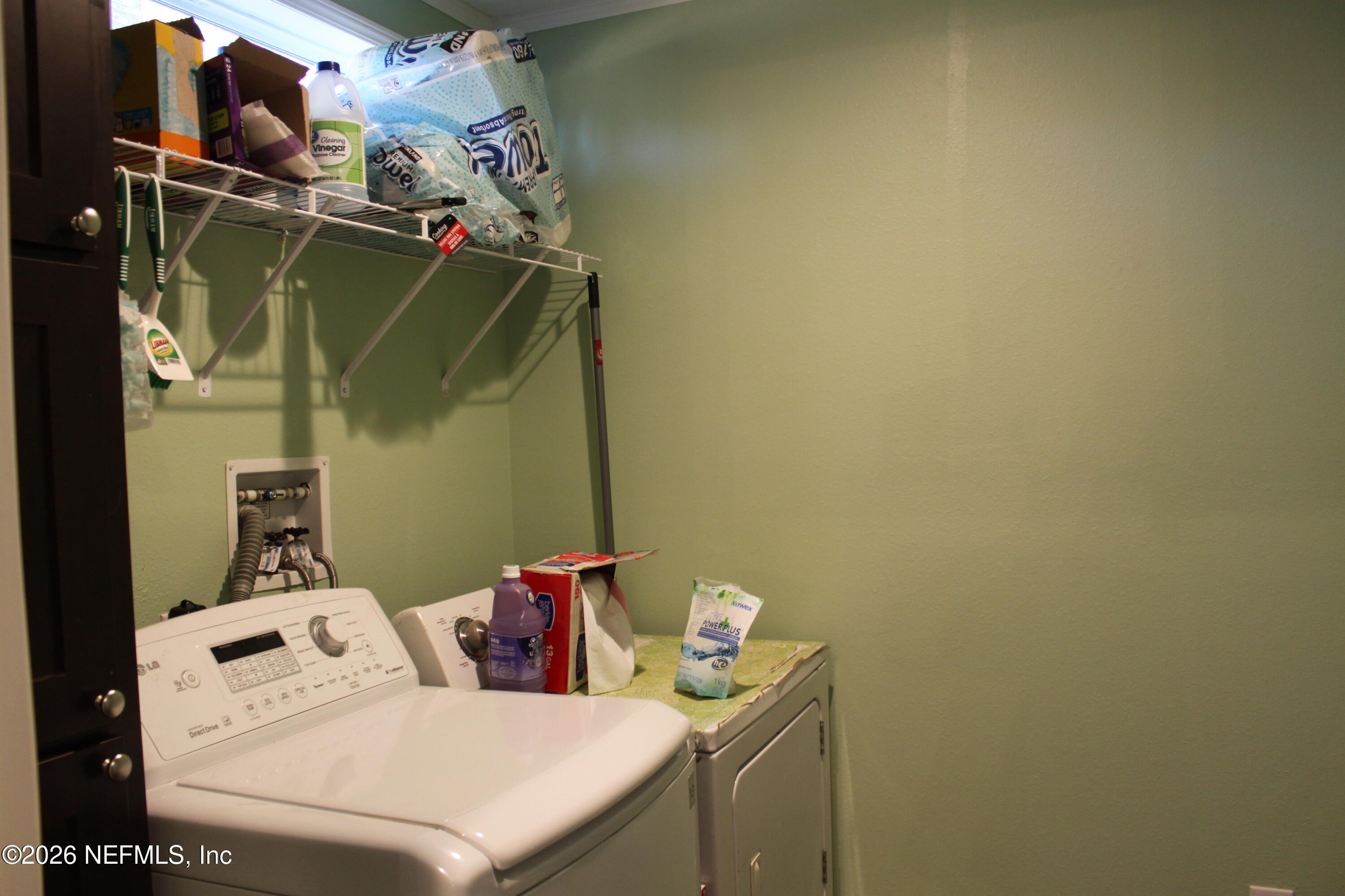 221 Magnolia Road Hawthorne, FL 32640 - Photo 13 of 18 a utility room with dryer and washer