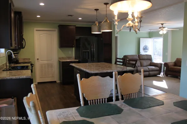 a view of a dining room with furniture