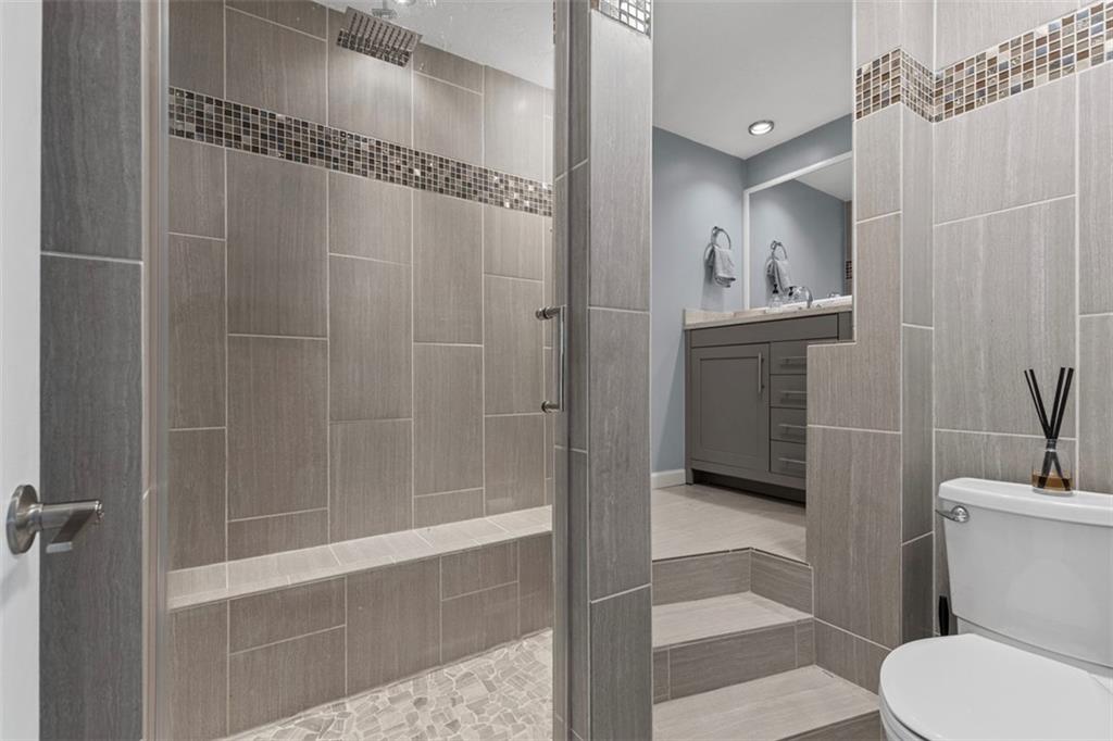 2219 Hill Road South Heights, PA 15081 - Photo 16 of 34 a bathroom with a shower a toilet and a sink